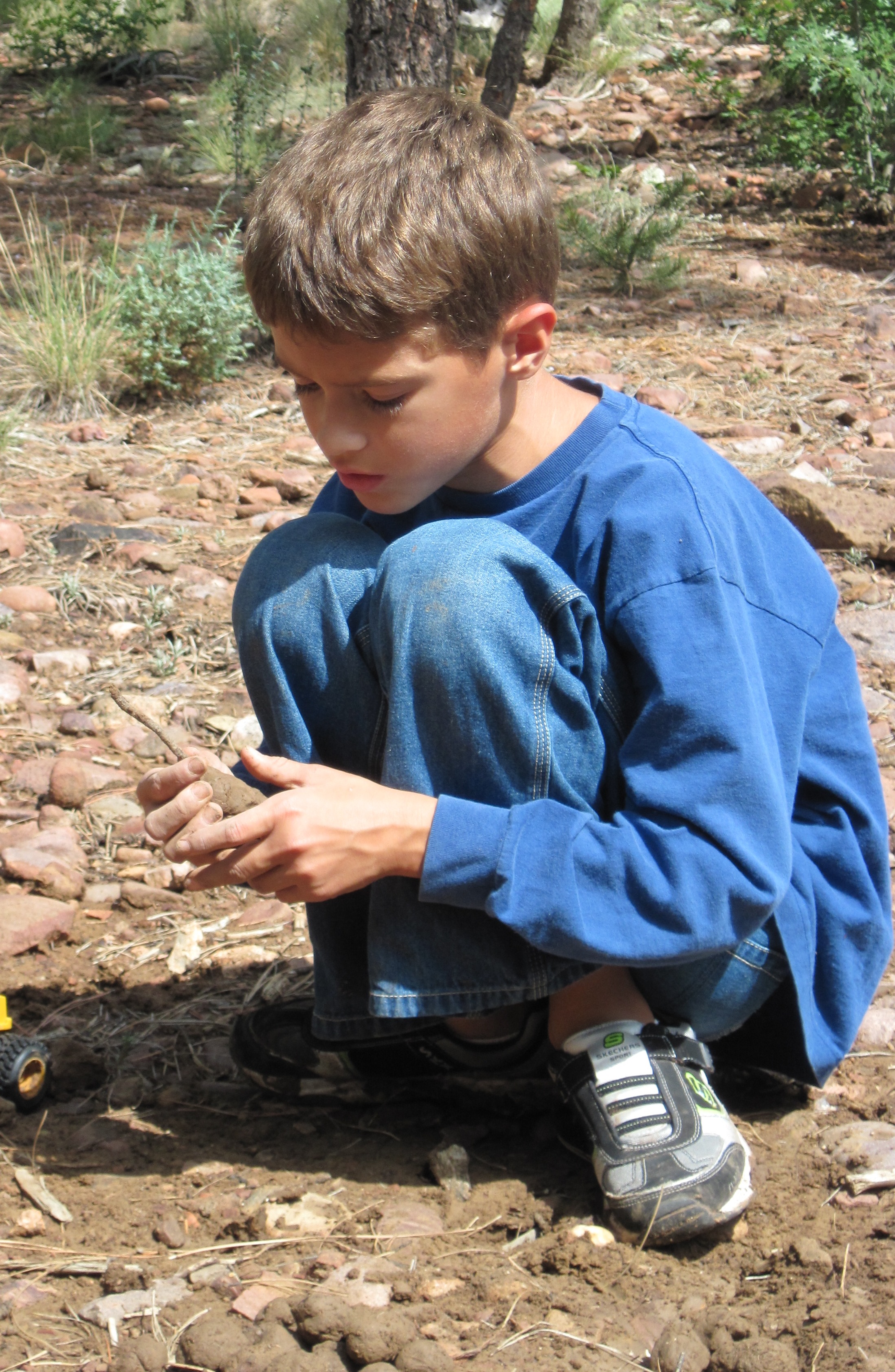Natalie's son as a child exploring outside